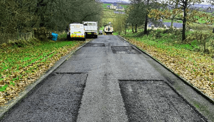 Damaged road surface cut out ready for resurfacing in Scotland