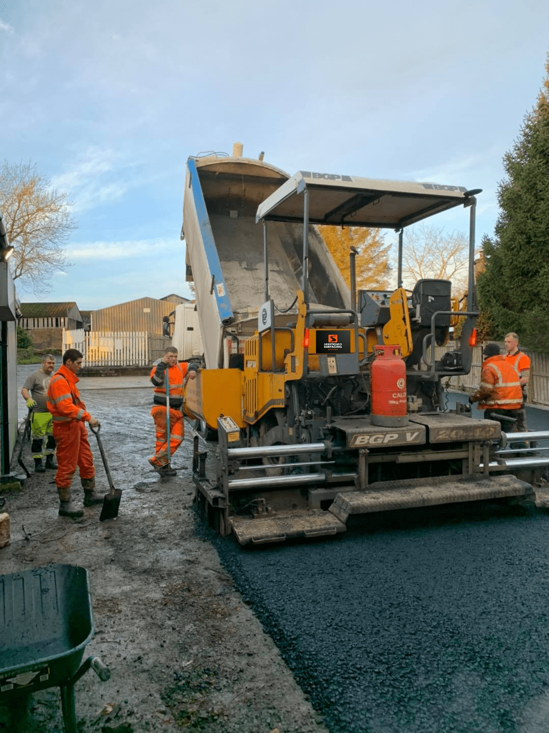 Armstrong's Surfacing Paver crew hire working with Barber Green machine in Scotland