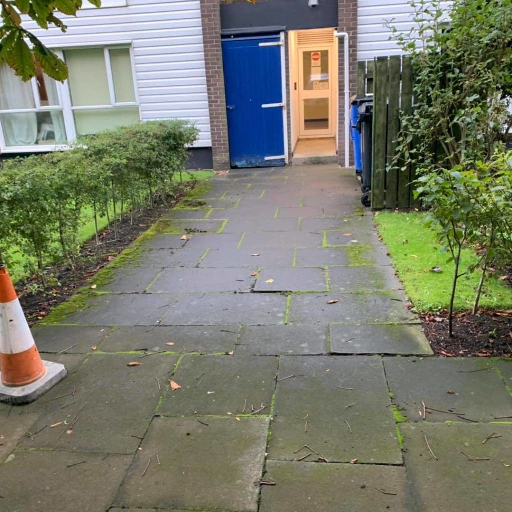 Broken flagstone path BEFORE tarmacadam work, Northern England